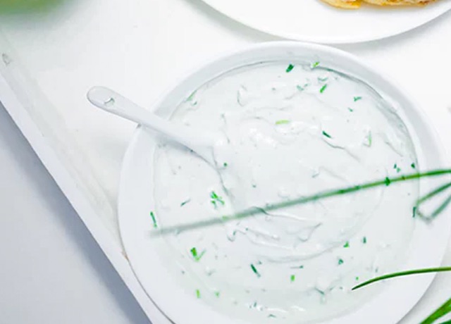 a yogurt dip in a white bowl
